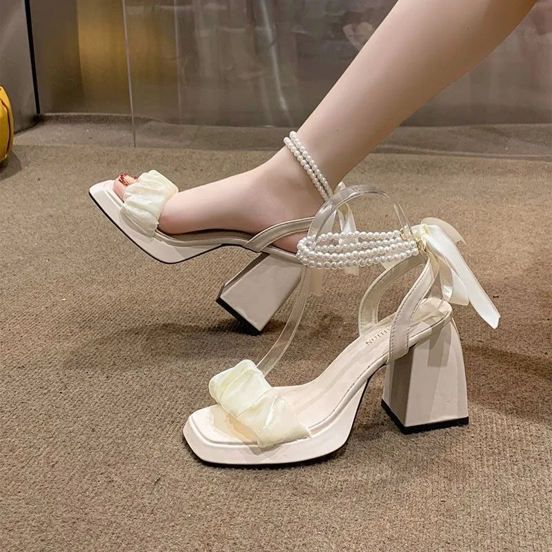 Low Block Heeled Sandals With A Pearl Ankle Strap